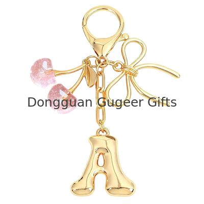 GUGEER Bubble Original Keychain with Bow & Cherry - كيس الحروف الذهبية السحر للنساء