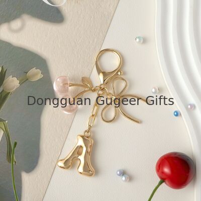 GUGEER Bubble Original Keychain with Bow & Cherry - كيس الحروف الذهبية السحر للنساء