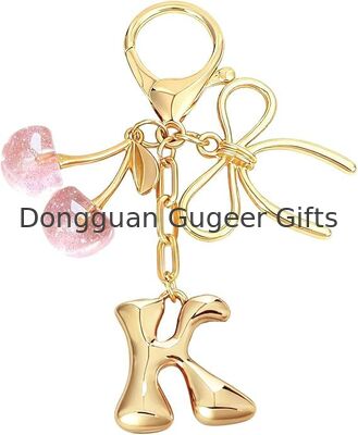 GUGEER Bubble Original Keychain with Bow & Cherry - كيس الحروف الذهبية السحر للنساء
